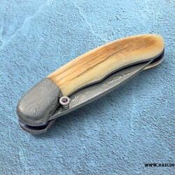 Mammoth Ivory Damascus and Ruby Folder closed view