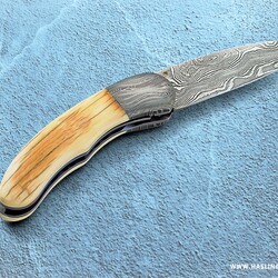 Mammoth Ivory Damascus and Ruby Folder right view