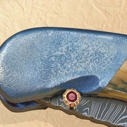 Stainless Damascus and Ruby Folder bolster view