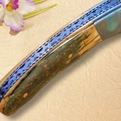 Stainless Damascus and Ruby Folder spine view