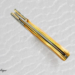 Stainless Mosaic Damascus Folder with Mammoth Ivory Gold and Peridot tip centered