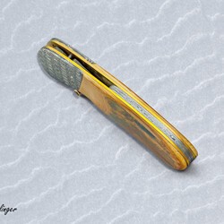 Stainless Mosaic Damascus Folder with Mammoth Ivory Gold and Peridot spine view