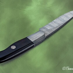 Cape Breton Hunter in Ladder Damascus and Ebony Handle spine view