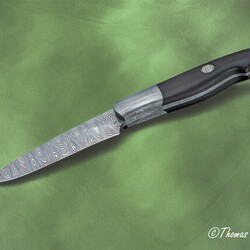 Cape Breton Hunter in Ladder Damascus and Ebony Handle edge view