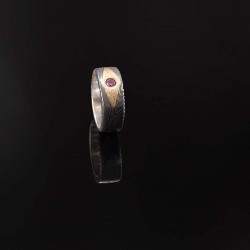 Forged Damascus ring with genuine ruby set in 24 carat yellow gold front view