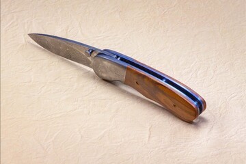 Stainless Damascus and Plum Wood Folding Knife side view