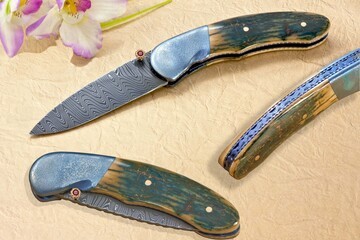 Stainless Damascus and Ruby Folder
