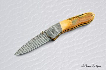 Stainless Mosaic Damascus Folder with Mammoth Ivory Gold and Peridot main view