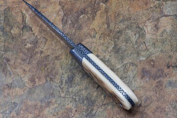 Crowsnest Damascus and Ivory Hunter spine view