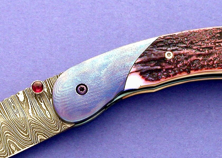 Carbon Damascus and Timascus and Ivory Folder close up