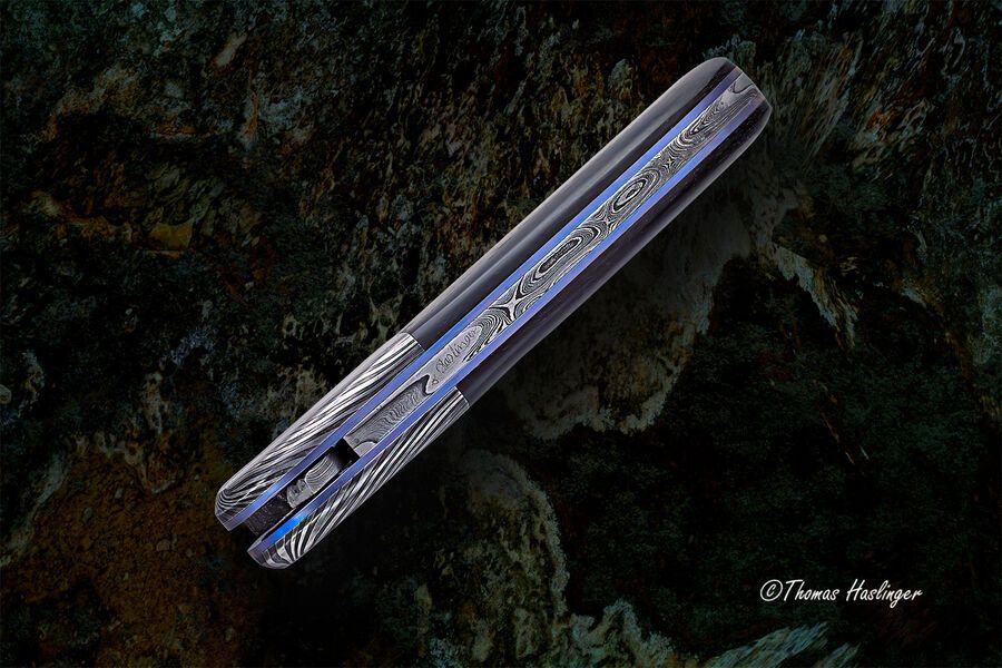 Ebony Reptilian Stainless Damascus Dress Folder spine view