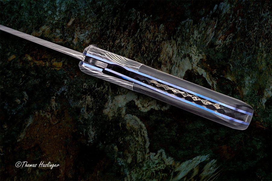 Ebony Reptilian Stainless Damascus Dress Folder lock side view