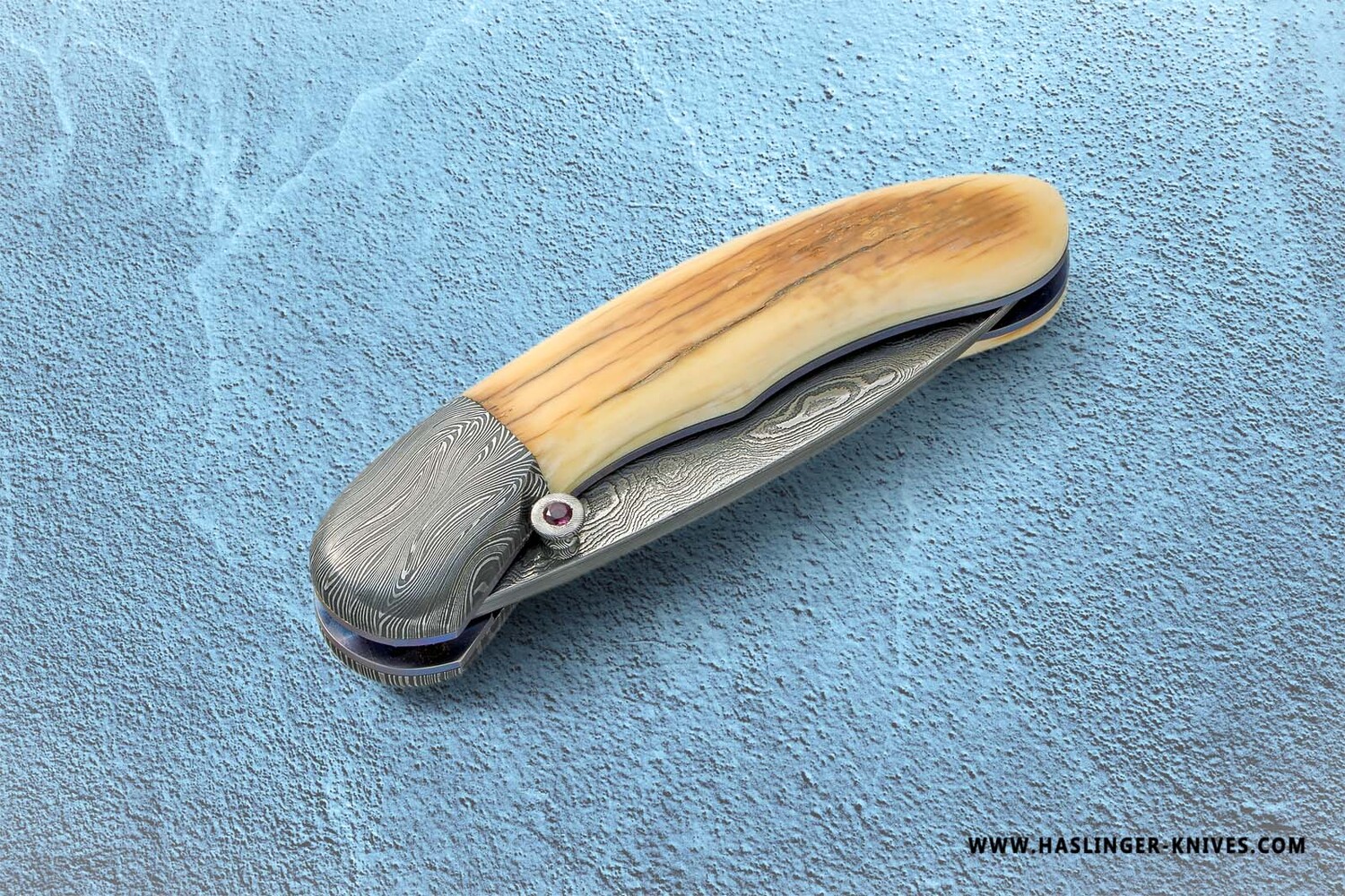 Mammoth Ivory Damascus and Ruby Folder closed view
