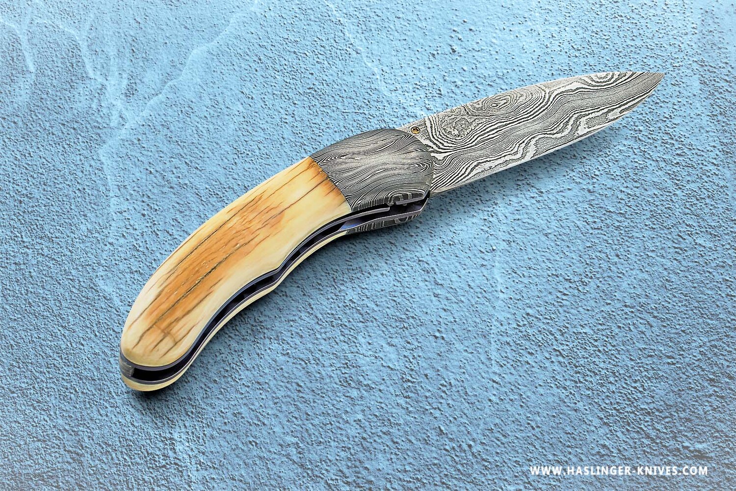 Mammoth Ivory Damascus and Ruby Folder right view
