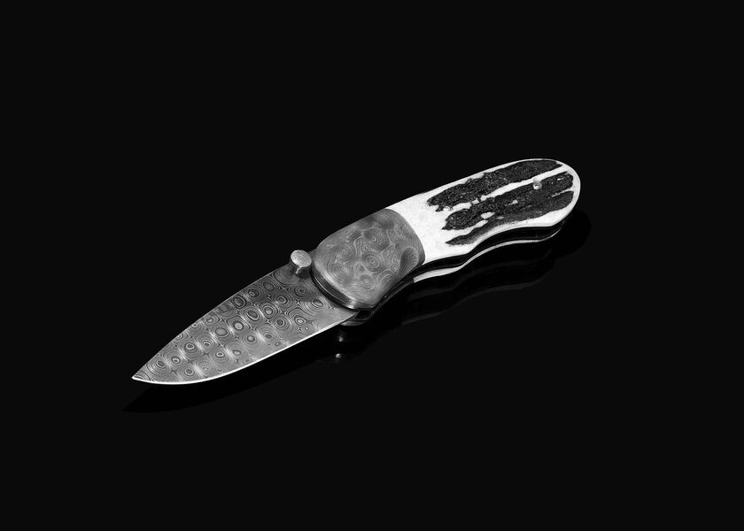 Sambar Stag and Damascus Folding Knife black white image