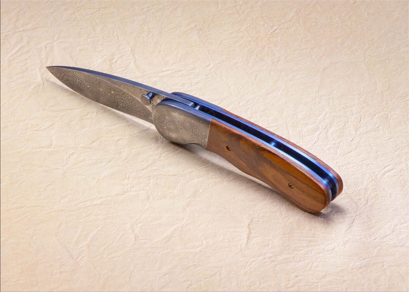 Stainless Damascus and Plum Wood Folding Knife side view