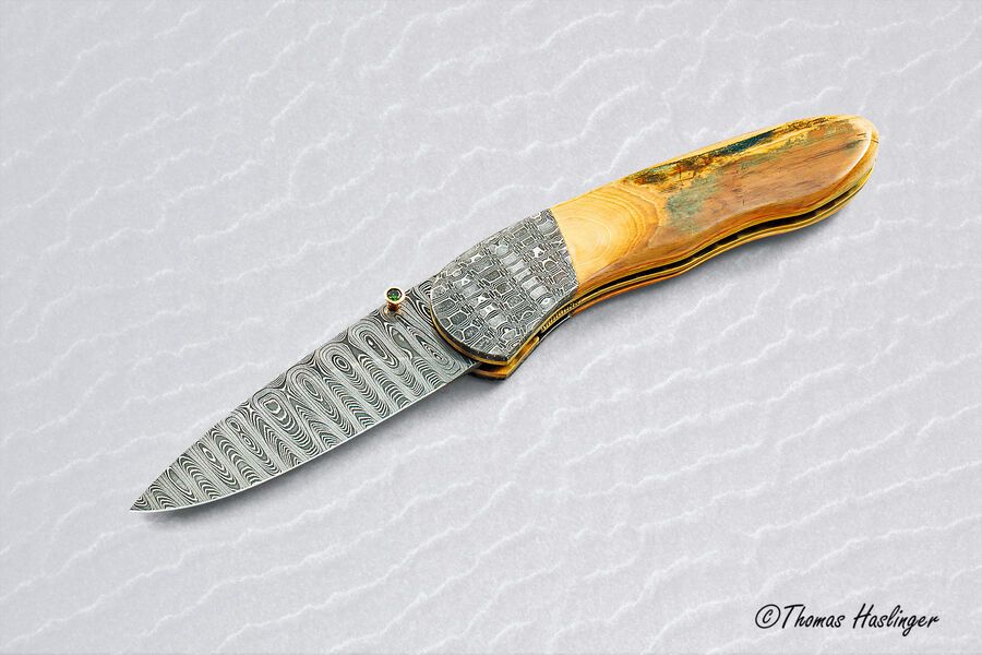 Stainless Mosaic Damascus Folder with Mammoth Ivory Gold and Peridot main view