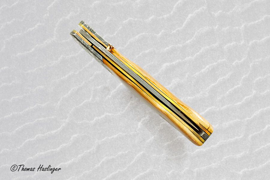 Stainless Mosaic Damascus Folder with Mammoth Ivory Gold and Peridot tip centered