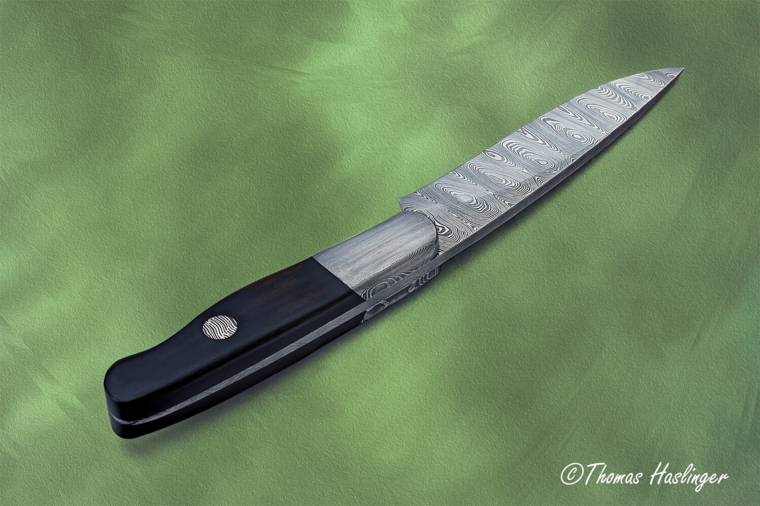 Cape Breton Hunter in Ladder Damascus and Ebony Handle spine view