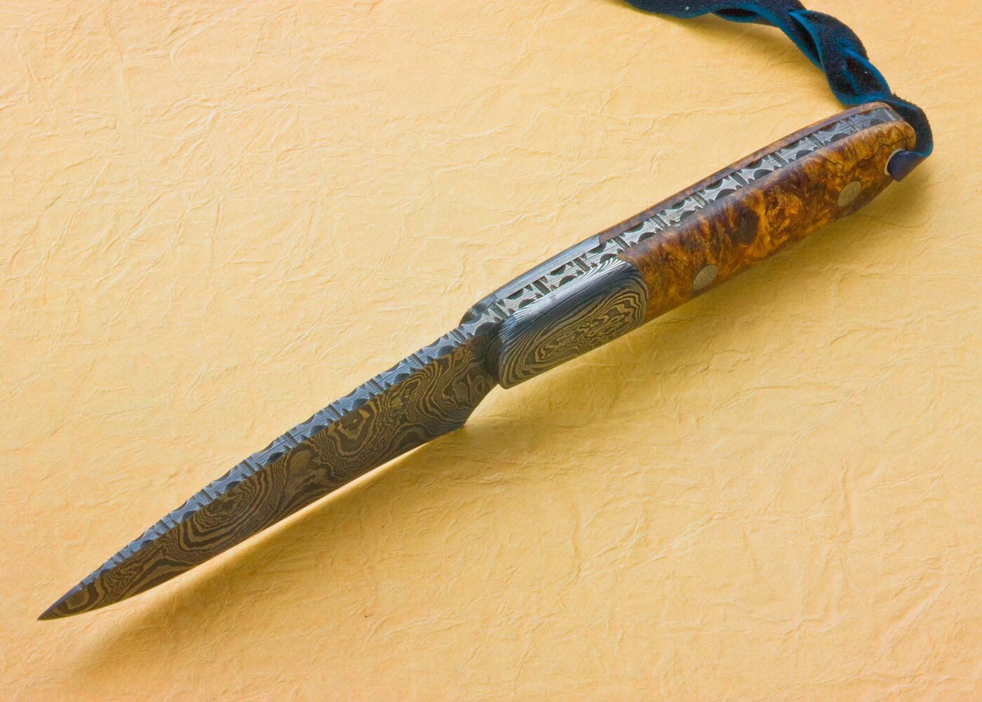 Damascus Cascades Hunter with Stabilized Maple Handle spine view