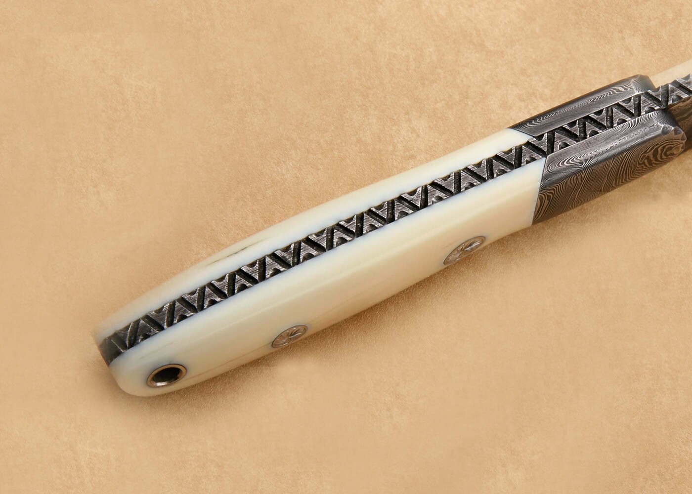 Walrus and Damascus Hunter Knife Engraved spine view