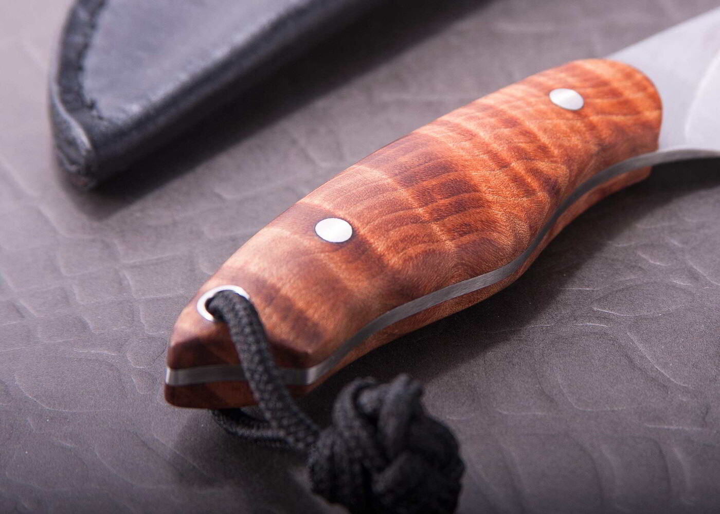 Fiddleback Maple Huntress in CPM S35-VN Stainless close up